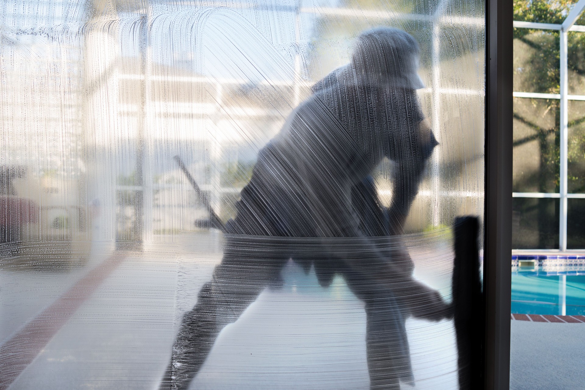 Window washer cleaning window